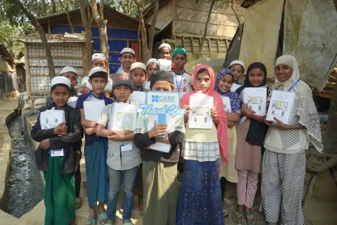 A group of orphaned children with a CBB volunteer