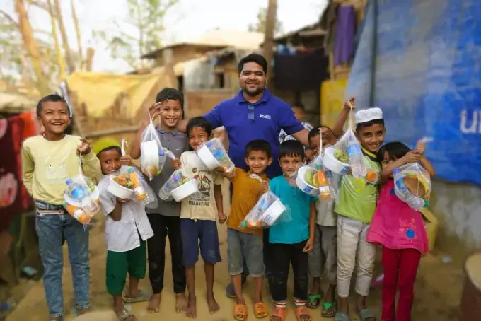 Children hold CBB orphan-sponsorship cards