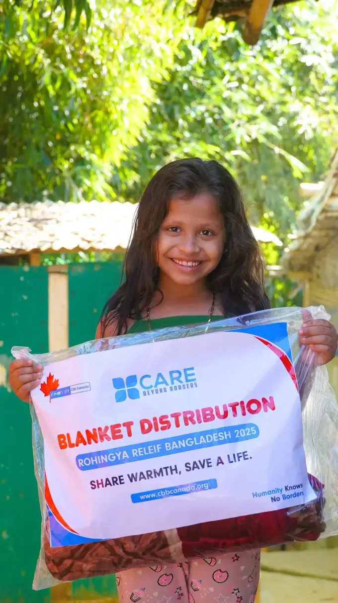 A smiling girl at a CBB winter distribution