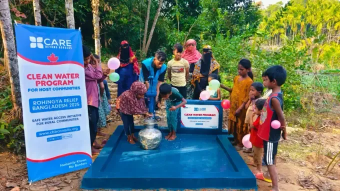 Children line up for clean water at a CBB pump