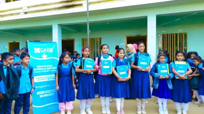 Children in uniform with CBB school kits