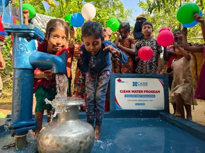 Children fill containers at a CBB community water point