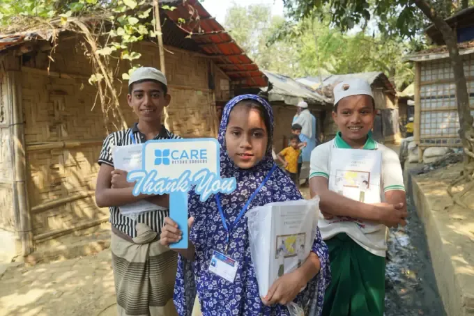 Boys holding CBB school-kit bags