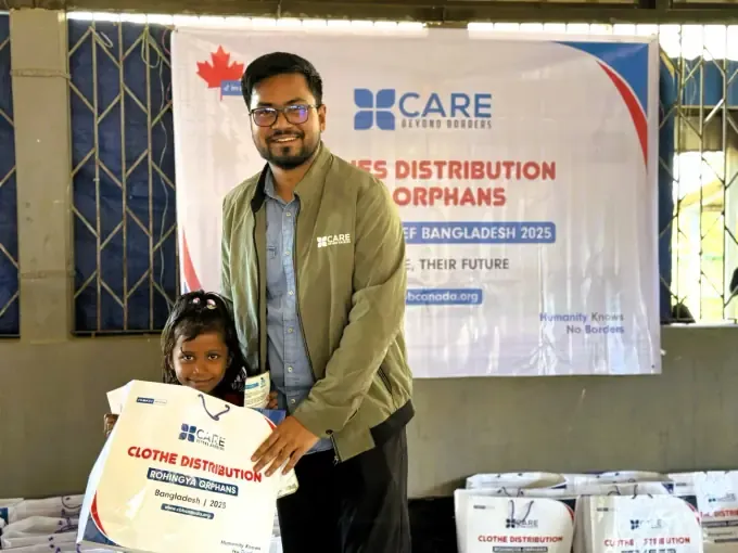 A CBB volunteer with sponsored children holding cards