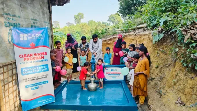 Children gather around a new CBB water point