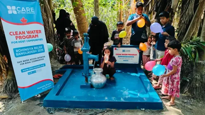 A woman draws clean water at a CBB Water Project pump