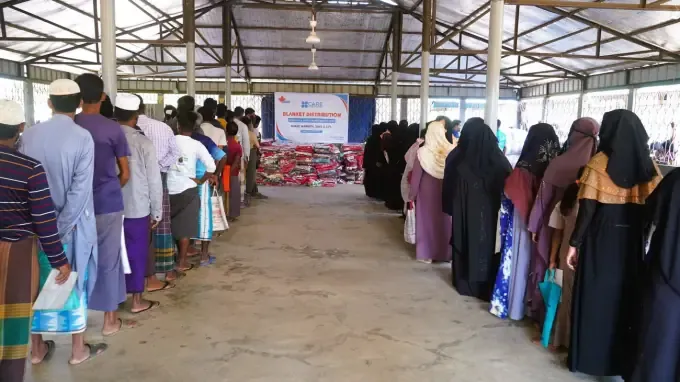 Girls at a CBB Share Warmth blanket distribution