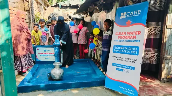 A boy washes at a CBB clean-water hand-pump