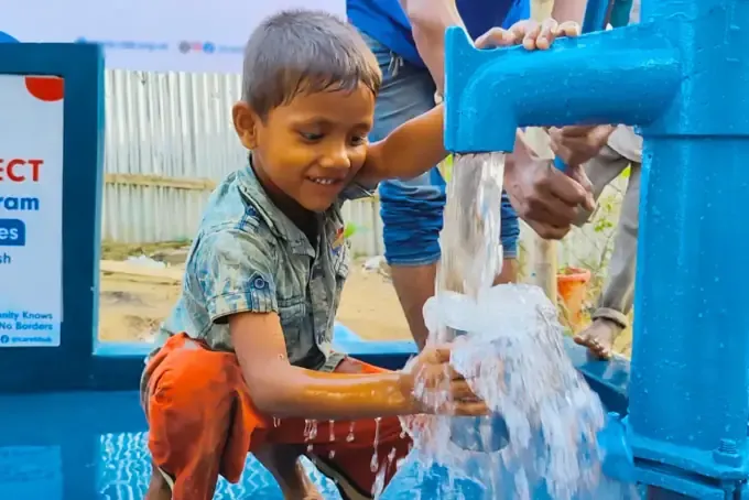 Children at a newly installed CBB hand-pump