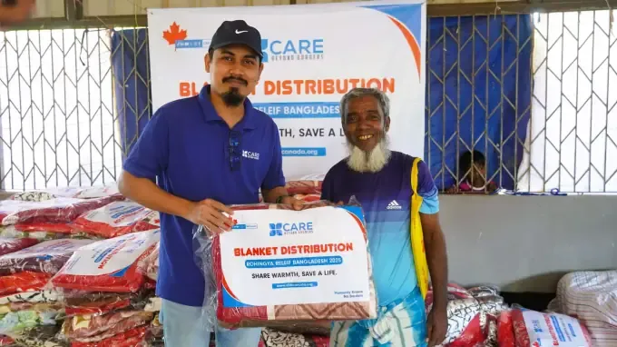 CBB volunteers with a blanket-distribution pack