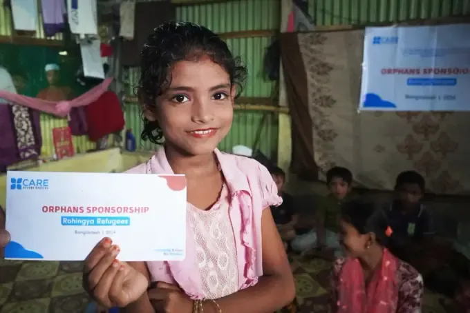 A smiling sponsored child